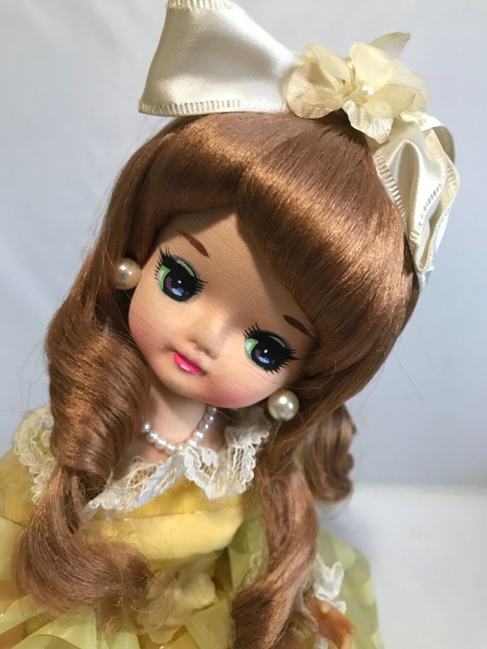 Big Eye Doll Musical "Oklahoma" Yellow Rotating Pedestal Auburn Hair
